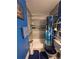Updated bathroom with a shower-tub combo, a blue shower curtain and modern fixtures, plus coordinated décor at 604 S Xenon Ct, Lakewood, CO 80228