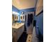 Cozy bathroom featuring a vanity with storage and a wall-mounted medicine cabinet for organization at 604 S Xenon Ct, Lakewood, CO 80228