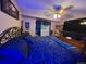 Bedroom with a large bed, a ceiling fan and a flat-screen TV, offers comfort and entertainment at 604 S Xenon Ct, Lakewood, CO 80228