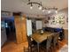Spacious dining area with hardwood floors, statement lighting, and ample storage at 604 S Xenon Ct, Lakewood, CO 80228