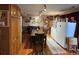 Inviting dining area featuring hardwood floors, a dining table, and cabinetry at 604 S Xenon Ct, Lakewood, CO 80228