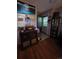 Charming entryway with hardwood floors, vintage radio and an open front door at 604 S Xenon Ct, Lakewood, CO 80228