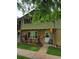 Inviting townhouse with a manicured lawn and a charming entryway at 604 S Xenon Ct, Lakewood, CO 80228
