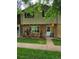 Charming townhouse with a well-maintained lawn and a cozy front porch at 604 S Xenon Ct, Lakewood, CO 80228