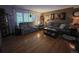 Comfortable living room with hardwood floors, two sofas, and neutral decor at 604 S Xenon Ct, Lakewood, CO 80228