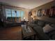 Inviting living room with hardwood floors, a plush sofa, and stylish decor at 604 S Xenon Ct, Lakewood, CO 80228