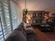 Spacious living room featuring a large sectional sofa and ample natural light at 604 S Xenon Ct, Lakewood, CO 80228