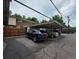 Exterior view of covered parking featuring multiple parking spaces and adjacent residential units at 604 S Xenon Ct, Lakewood, CO 80228