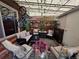 Relaxing outdoor patio area with comfortable seating, greenery, and a lattice shade covering at 604 S Xenon Ct, Lakewood, CO 80228