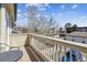 Charming balcony view featuring a serene neighborhood setting with flowering trees and distant buildings at 8707 E Florida Ave # 814, Denver, CO 80247