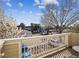 Balcony view overlooking a parking area and tree-lined street, offering a pleasant outdoor space at 8707 E Florida Ave # 814, Denver, CO 80247