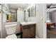 Bathroom features a vanity sink, toilet, and shower at 8707 E Florida Ave # 814, Denver, CO 80247