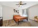Bright bedroom features a ceiling fan, carpeted floor, neutral walls, and a cozy area rug at 8707 E Florida Ave # 814, Denver, CO 80247