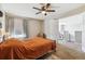 Cozy bedroom features a ceiling fan, carpeted floor, and neutral walls at 8707 E Florida Ave # 814, Denver, CO 80247