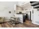 Open kitchen with stainless steel appliances and ample counter space, seamlessly connected to dining area at 8707 E Florida Ave # 814, Denver, CO 80247