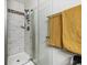 Updated shower features a glass door and tiled walls at 8707 E Florida Ave # 814, Denver, CO 80247