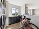 Cozy upstairs loft area with exercise bike, providing a quiet space for fitness and relaxation at 8707 E Florida Ave # 814, Denver, CO 80247