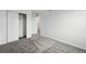 Bright bedroom featuring soft carpeting, a sliding-door closet, and neutral paint at 17115 W 91St Ln, Arvada, CO 80007