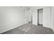 Neutral bedroom featuring gray carpet, white walls, and closet at 17115 W 91St Ln, Arvada, CO 80007