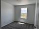 Bedroom featuring plush carpet and a bright window with outdoor views at 17115 W 91St Ln, Arvada, CO 80007