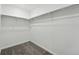 Walk-in closet offers ample storage with adjustable shelving and neutral carpeting at 17115 W 91St Ln, Arvada, CO 80007