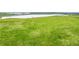 Expansive green space and tranquil lake offering picturesque views at 17115 W 91St Ln, Arvada, CO 80007