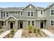 Charming townhome featuring neutral exteriors, landscaping, and inviting entrances at 17115 W 91St Ln, Arvada, CO 80007