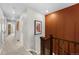 Bright upstairs hallway featuring carpet and views to the bedroom at 17115 W 91St Ln, Arvada, CO 80007