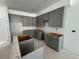 Spacious kitchen features gray cabinets and ample space for customization at 17115 W 91St Ln, Arvada, CO 80007