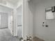 Hallway with entry to laundry room at 17115 W 91St Ln, Arvada, CO 80007