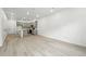 Bright living area featuring wood floors and access to a modern kitchen at 17115 W 91St Ln, Arvada, CO 80007