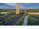 Grand entrance to the Aurora Highlands community with a clock tower at 3443 N Denali St, Aurora, CO 80019