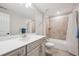 Well-lit bathroom features a modern vanity with a sink and a shower-tub combination with tiled walls at 17409 Springfield Dr, Parker, CO 80134