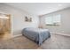 Serene bedroom with carpet, a bright window, and an en suite bathroom at 17409 Springfield Dr, Parker, CO 80134