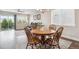 Cozy dining area with natural light, hardwood floors, and views into the living room at 17409 Springfield Dr, Parker, CO 80134
