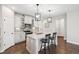 Stylish kitchen with a center island, white cabinets, granite countertops and stainless steel appliances at 17409 Springfield Dr, Parker, CO 80134
