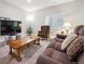Basement featuring carpeted floor, comfortable seating, large TV, and a lot of natural light at 17409 Springfield Dr, Parker, CO 80134