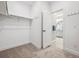 A spacious walk-in closet that connects to a well-lit bathroom, offering ample storage and convenience at 17409 Springfield Dr, Parker, CO 80134