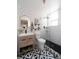 Modern bathroom with subway tile, a glass-enclosed shower, and a patterned tile floor at 215 E 11Th Ave # A5, Denver, CO 80203