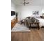 Bright and airy bedroom featuring a seating area, stylish rug and decor, and a comfortable bed at 215 E 11Th Ave # A5, Denver, CO 80203