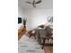 Bright and airy bedroom featuring a seating area with a stylish rug and decor, and a ceiling fan at 215 E 11Th Ave # A5, Denver, CO 80203