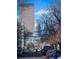 View of the Colorado State Capitol framed by city buildings and trees at 215 E 11Th Ave # A5, Denver, CO 80203