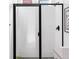 Modern bathroom features a tiled walk-in shower with glass doors and matte black fixtures and hexagonal floor tiling at 1925 W 165Th Way, Broomfield, CO 80023