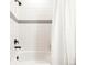 Updated bathroom featuring a soaking tub, modern fixtures, and bright, white tile at 1925 W 165Th Way, Broomfield, CO 80023