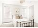 Inviting bedroom featuring a bed with neutral linens, art piece on the wall and windows that bring in natural light at 1925 W 165Th Way, Broomfield, CO 80023