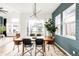 Dining room with modern light fixture and natural light streaming through a large window at 1925 W 165Th Way, Broomfield, CO 80023