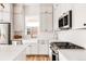 This gorgeous white kitchen features bright countertops and stainless appliances at 1925 W 165Th Way, Broomfield, CO 80023