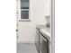 Modern laundry room with front-loading washer and dryer and a large window at 1925 W 165Th Way, Broomfield, CO 80023