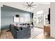 The spacious living room offers modern lighting, hardwood floors, and large windows at 1925 W 165Th Way, Broomfield, CO 80023