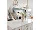 A view of the living room from the bright kitchen highlights the stairs at 1925 W 165Th Way, Broomfield, CO 80023